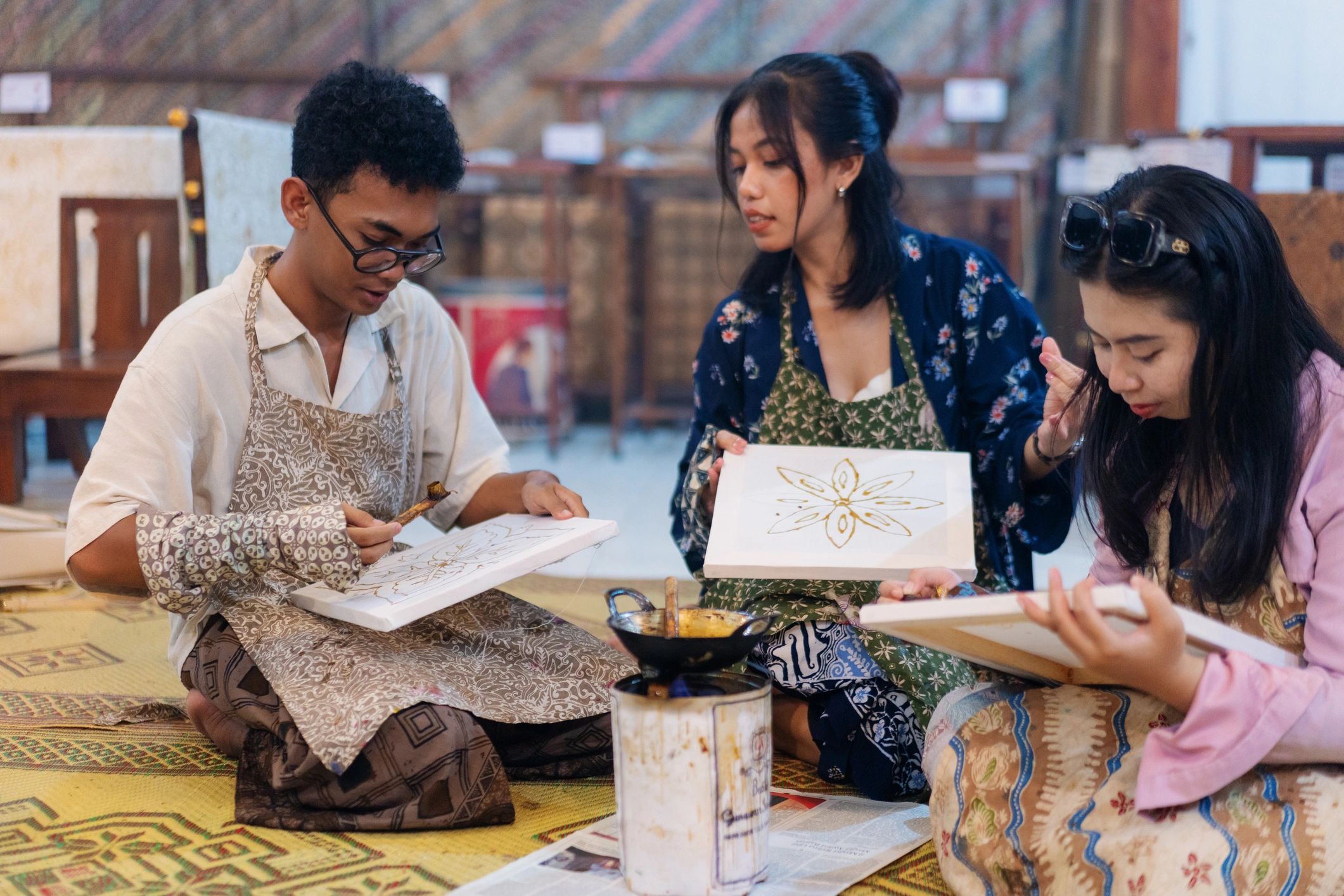 Group in a textile workshop working on fabric